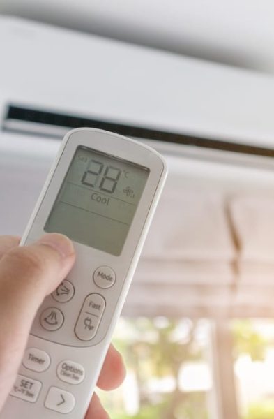 Hand,With,Remote,Control,Directed,On,Air,Conditioner