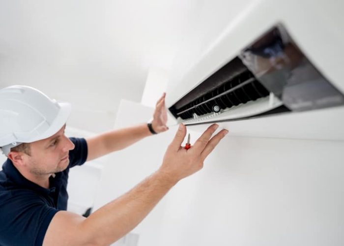 Technician,Cleans,Air,Conditioner,System,In,A,Modern,Apartment.